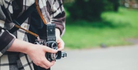 Person holding a vintage camera