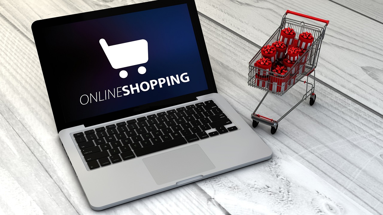 Open laptop displaying Online Shopping and a cart
